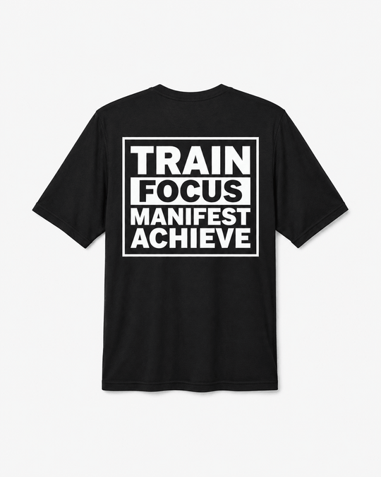 A black short-sleeve t-shirt with a bold white graphic print on the front reading 'TRAIN FOCUS MANIFEST ACHIEVE' inside a rectangular border, shown against a light gray background.